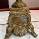 Fireplace trim clock and adornment of antique bronze candelabra