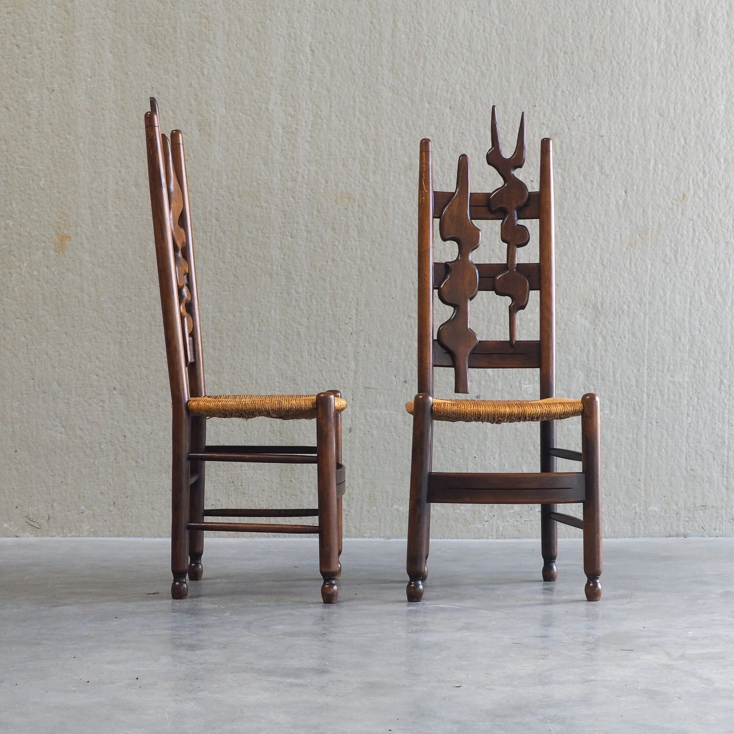 2 sculptural brutalist high-back chairs