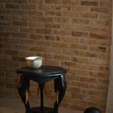 Side table in hardwood ebony with three elephant head-shaped legs, Eastern India, 1920s.