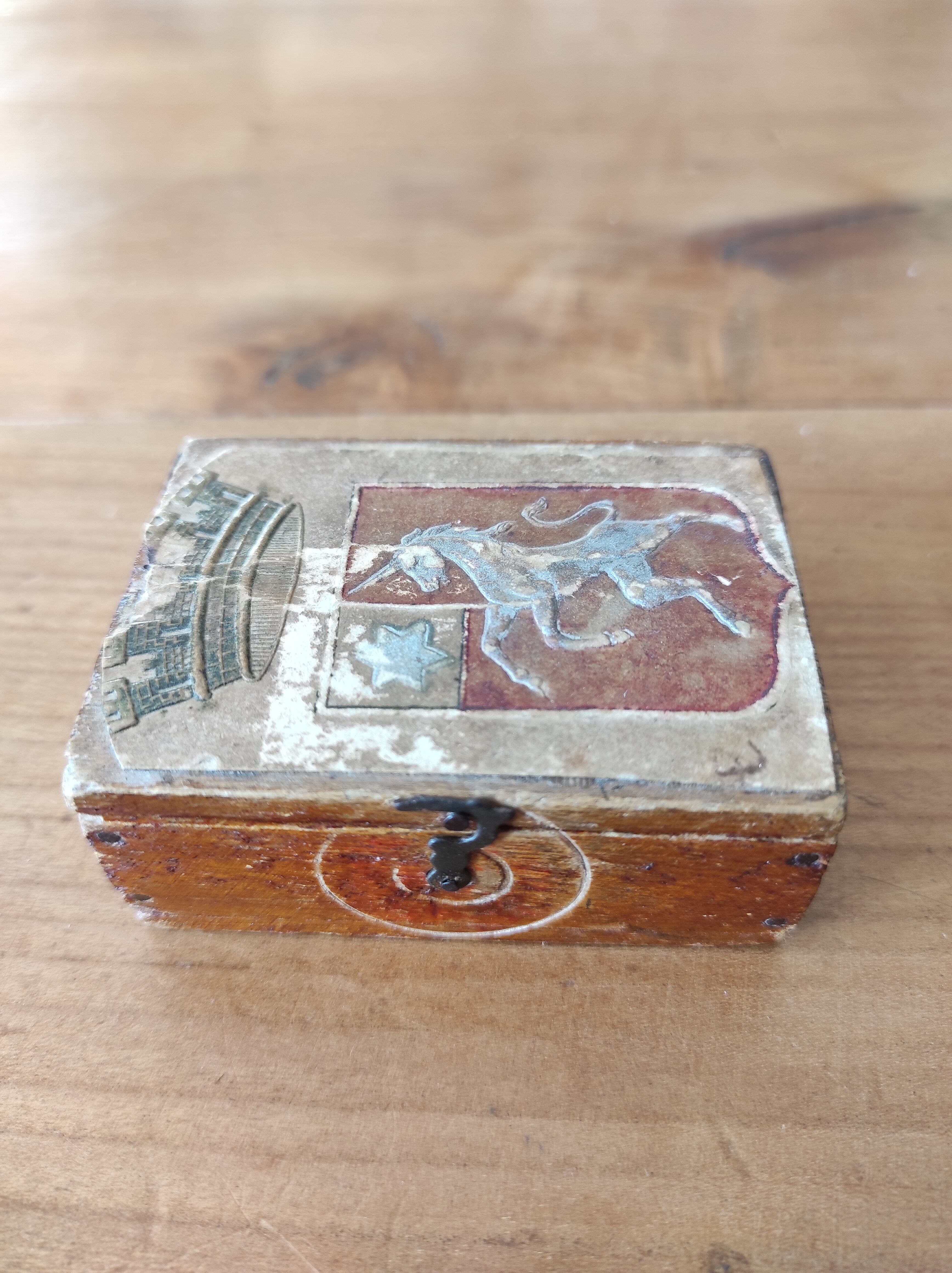 Wooden box decorated badge and unicorn