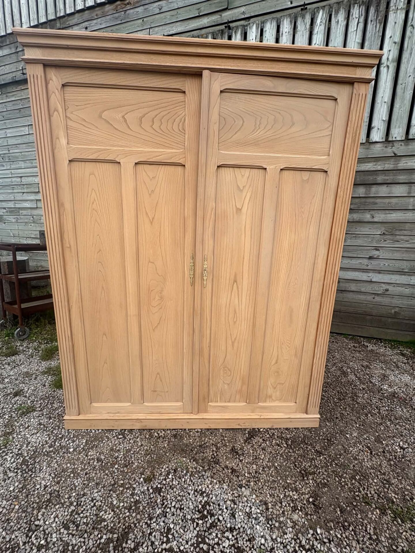 Large antique wardrobe in raw wood