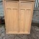 Large antique wardrobe in raw wood