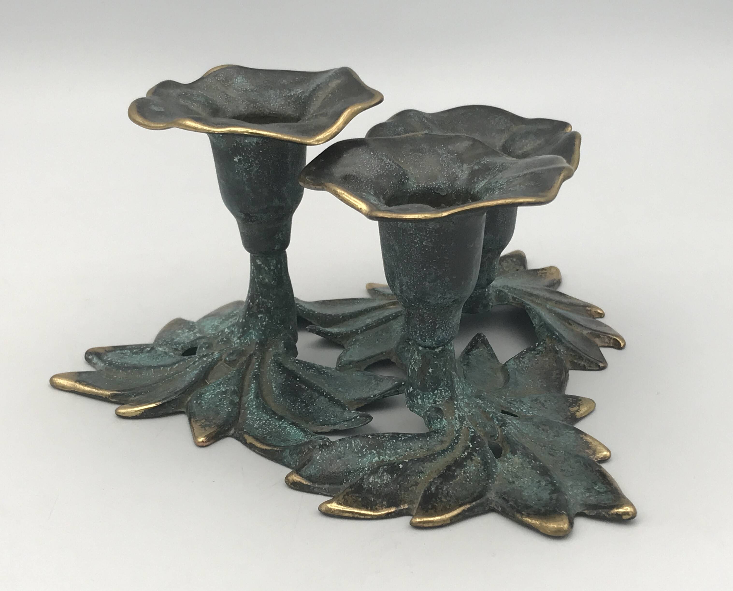3-flower brass candlestick with green patina