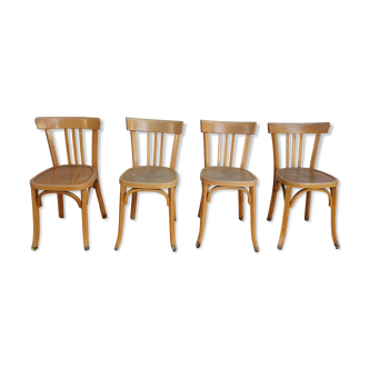 4 chaises de bistrot dont estampillée Baumann