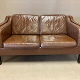 Scandinavian design 2-seater leather sofa.