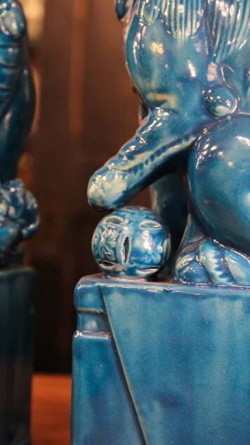 Pair of Foo dog bookends in turquoise glazed ceramic, Manises