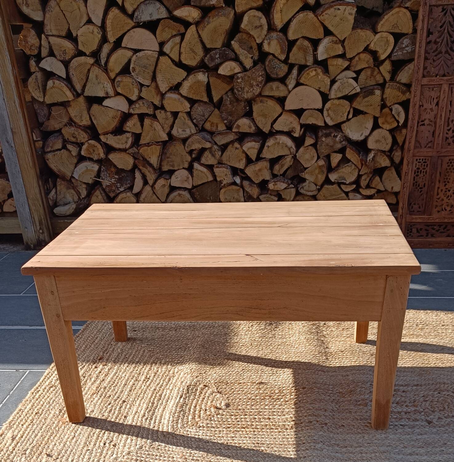 Low farmhouse table in raw wood