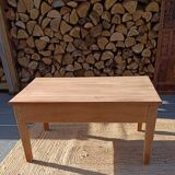 Low farmhouse table in raw wood