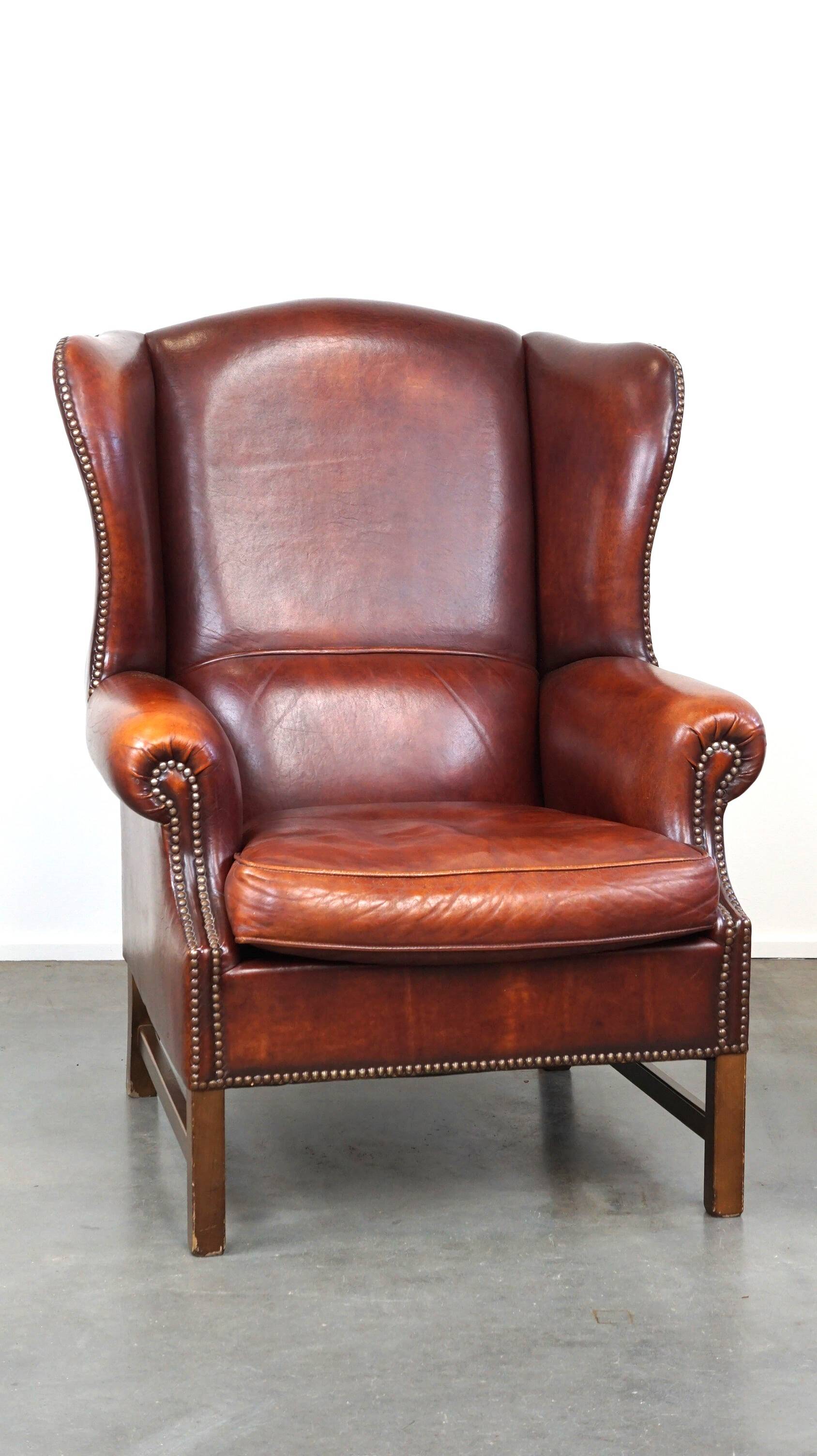 Large comfortable sheepleather wingchair in good condition and beautiful colours