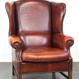Large comfortable sheepleather wingchair in good condition and beautiful colours