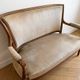 Louis XVI style antique canapé in wood and beige fabric.
