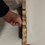Mirror with its openwork frame