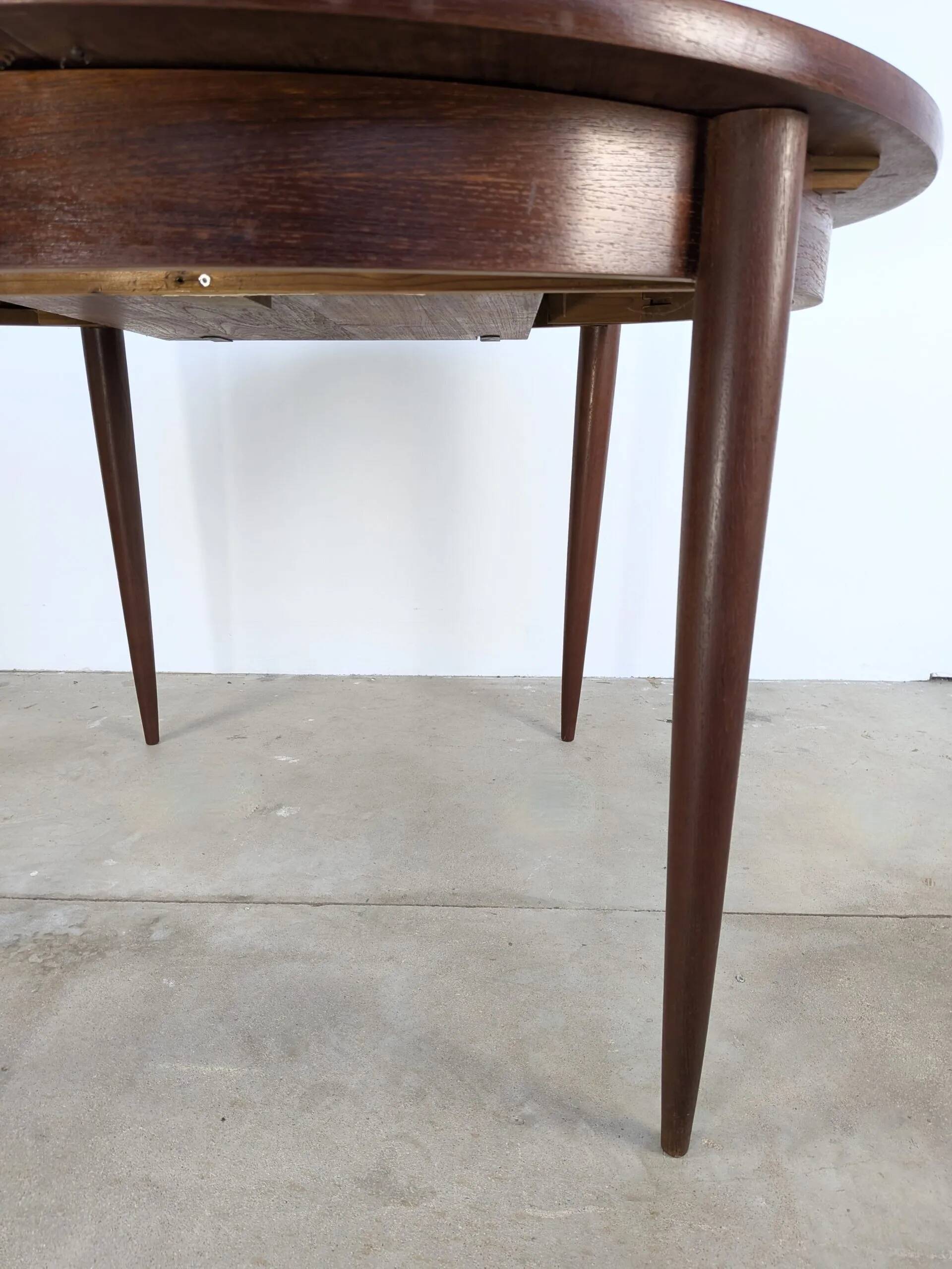 Round extendable wooden dining table