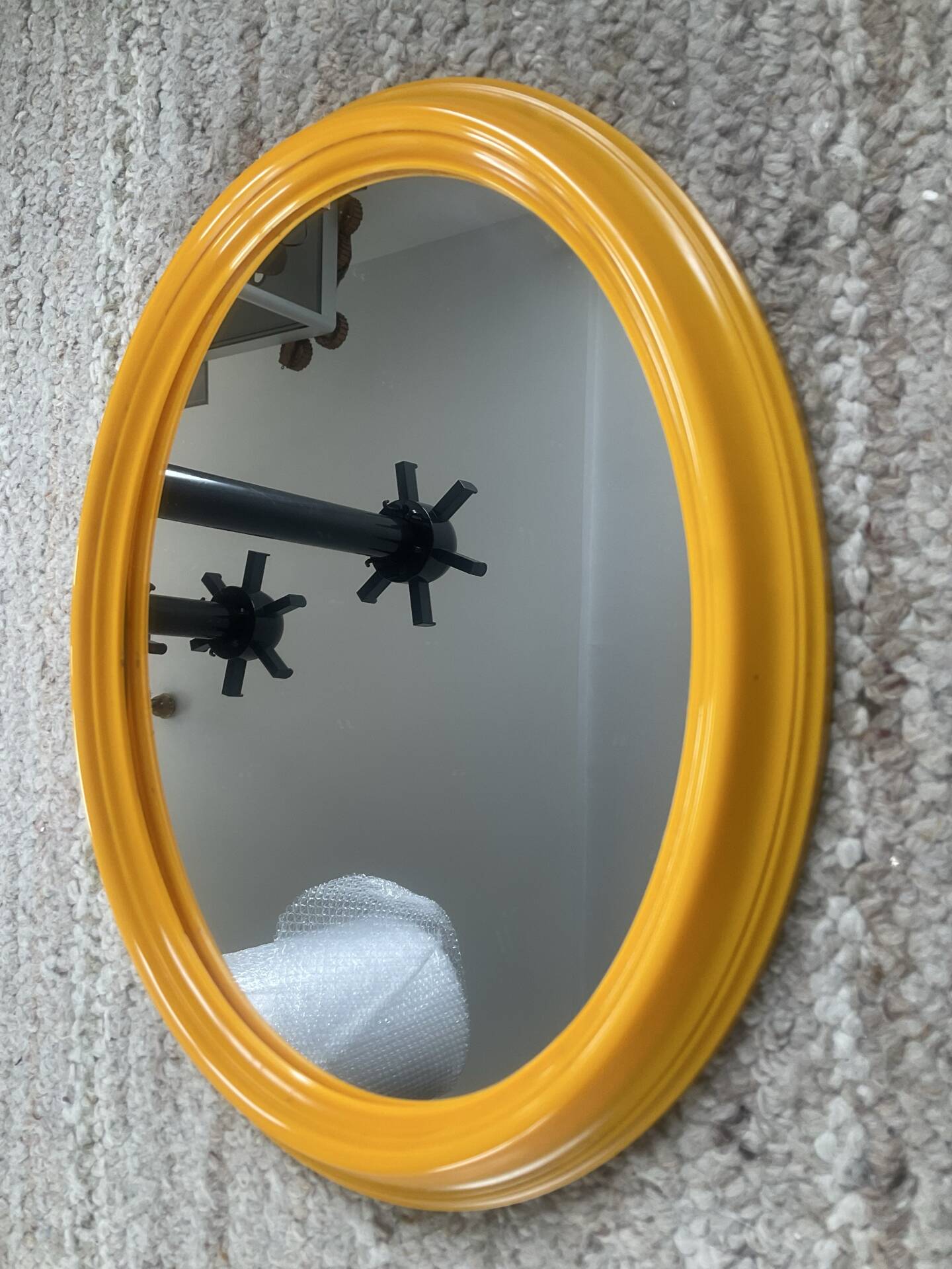 Vintage oval mirror from the 1970s.
