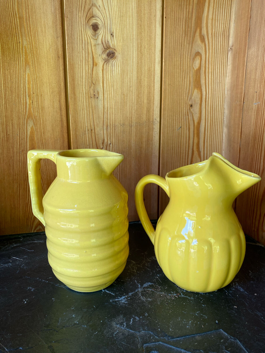 2 old lemon yellow jugs