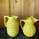 2 old lemon yellow jugs