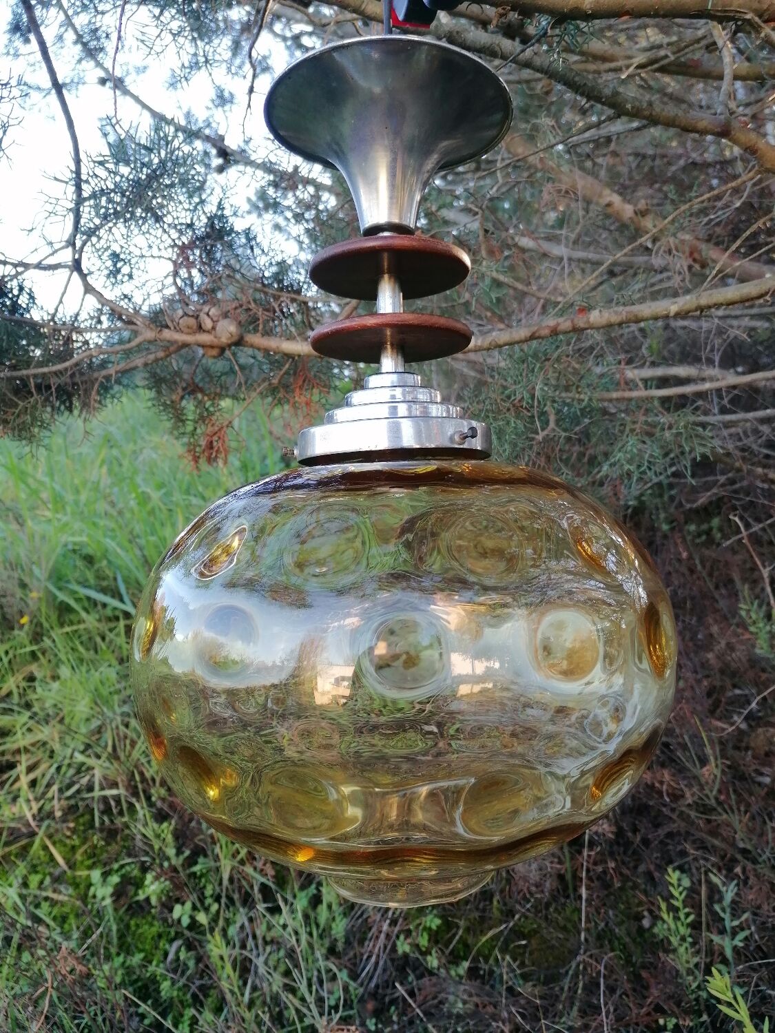 Vintage suspension ball in amber glass