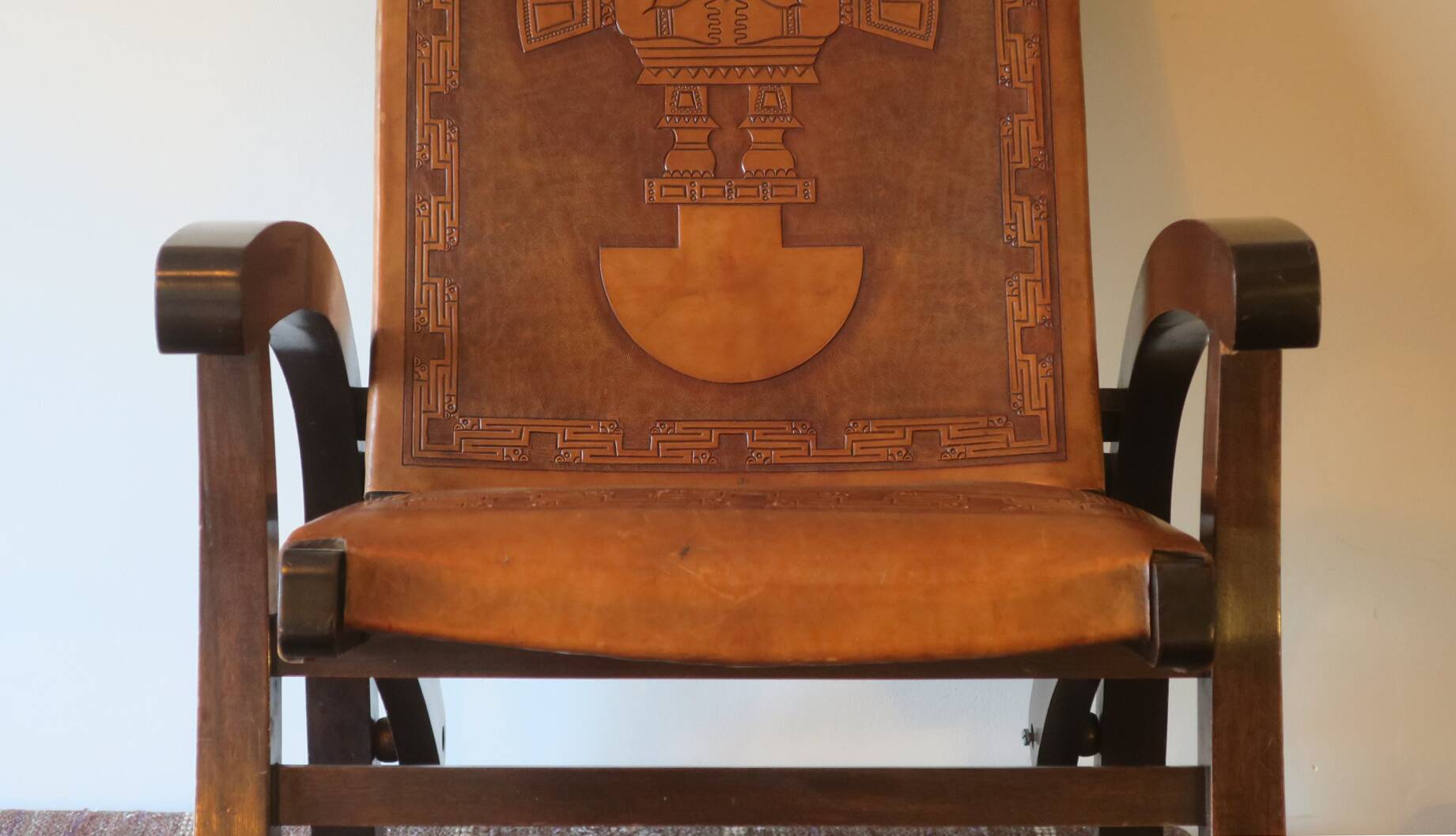 Tiahuanaco design tooled leather folding armchair by Angel Pazmino, Ecuador