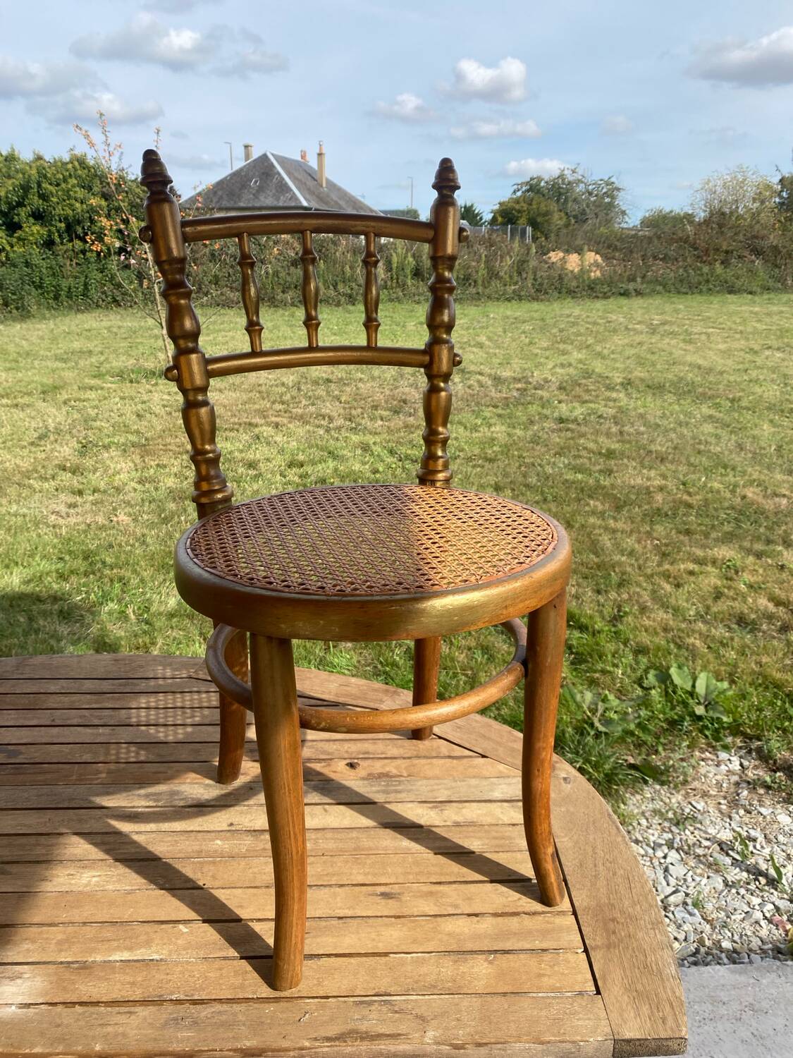 Children's chair in cane and curved wood