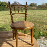 Children's chair in cane and curved wood