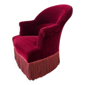Fauteuil vintage bordeaux avec franges