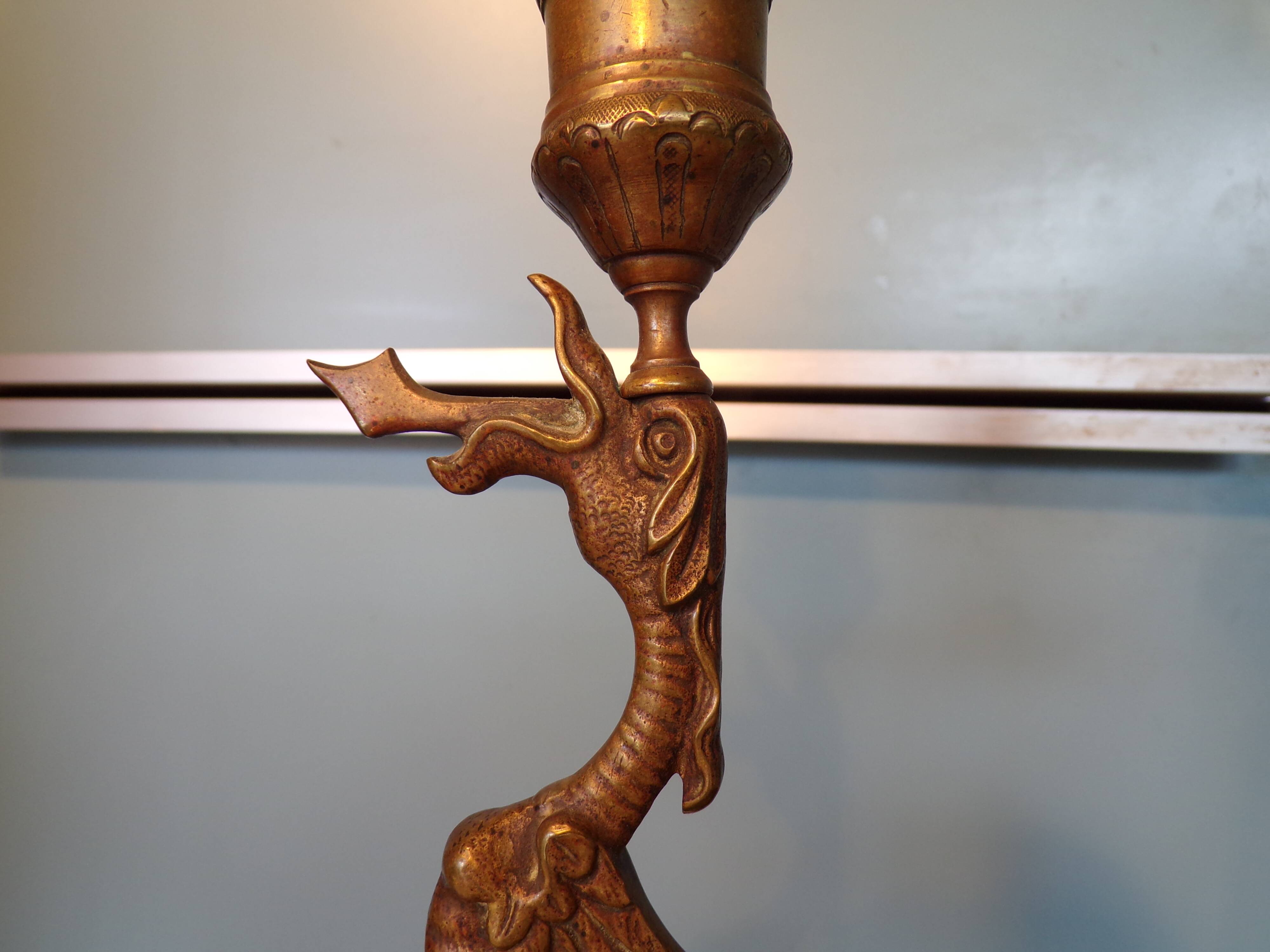Pair of bronze chimera candlesticks