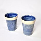 2 blue textured ceramic mugs