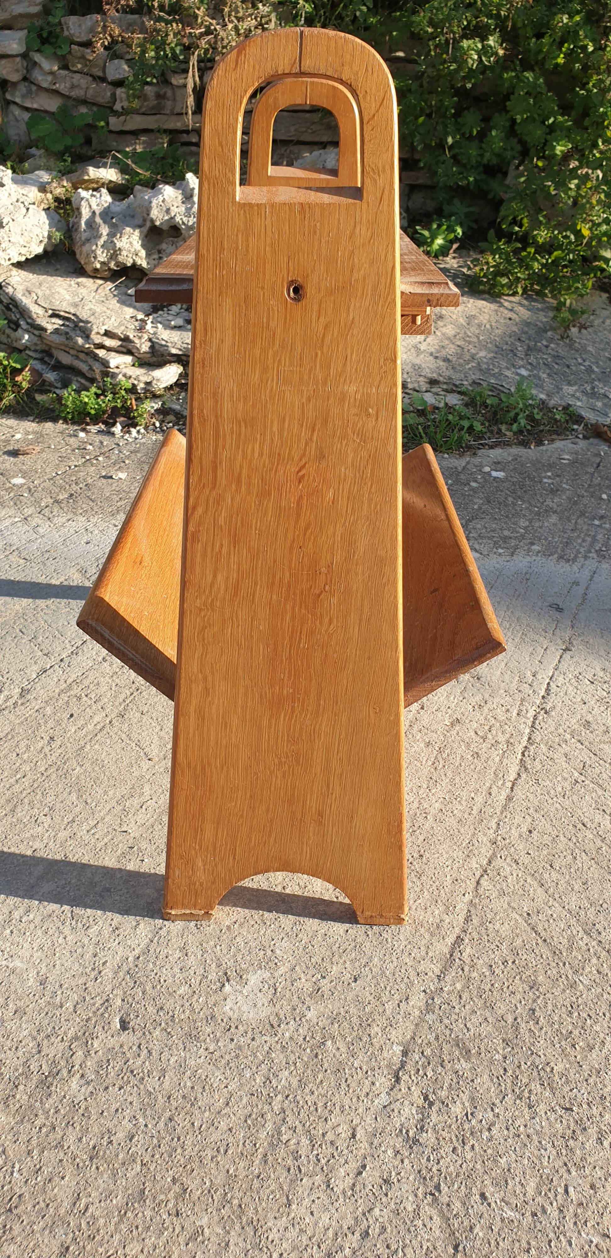 Magazine rack with sliding drawers in light wood, Scandinavian style.