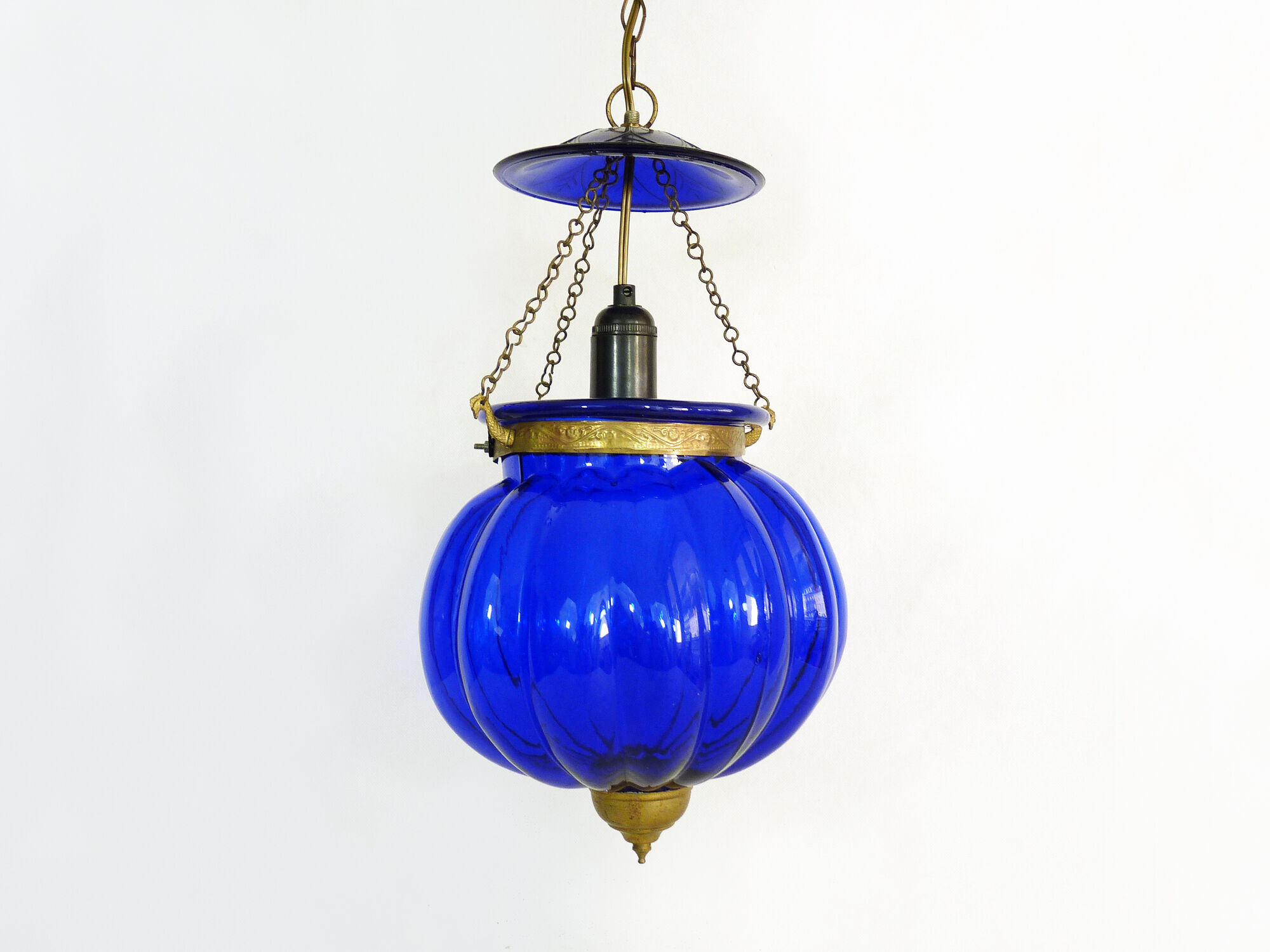 Suspension chandelier, oriental blue glass lantern and brass structure. Year 70-80