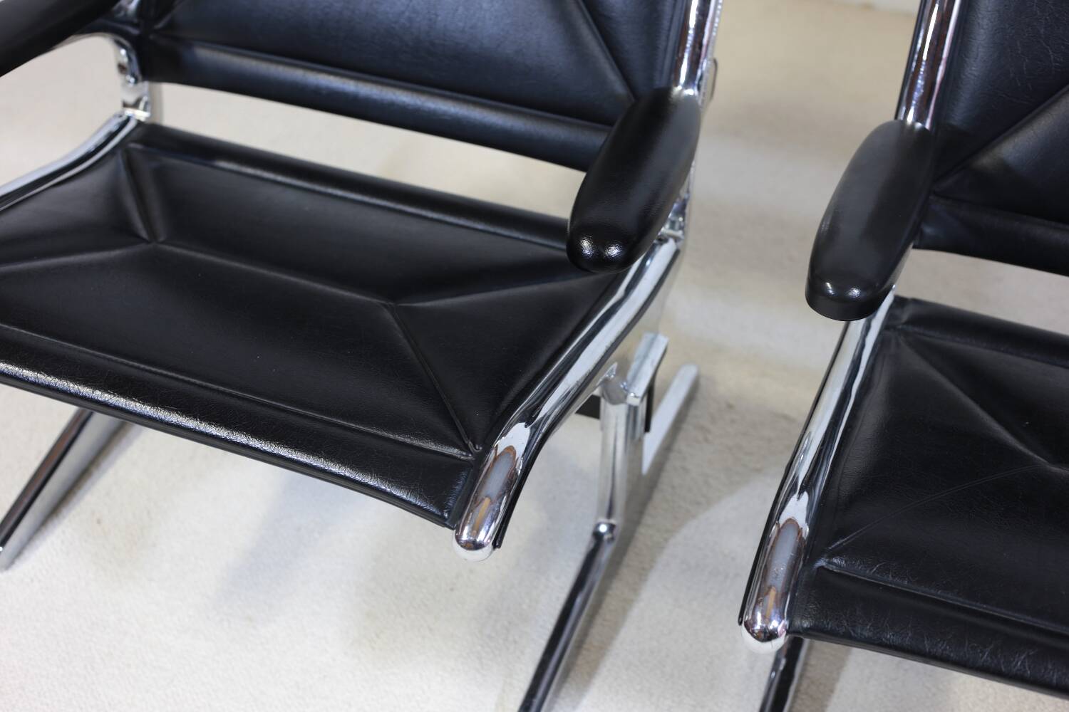 Pair of Eames Sling Tandem armchairs