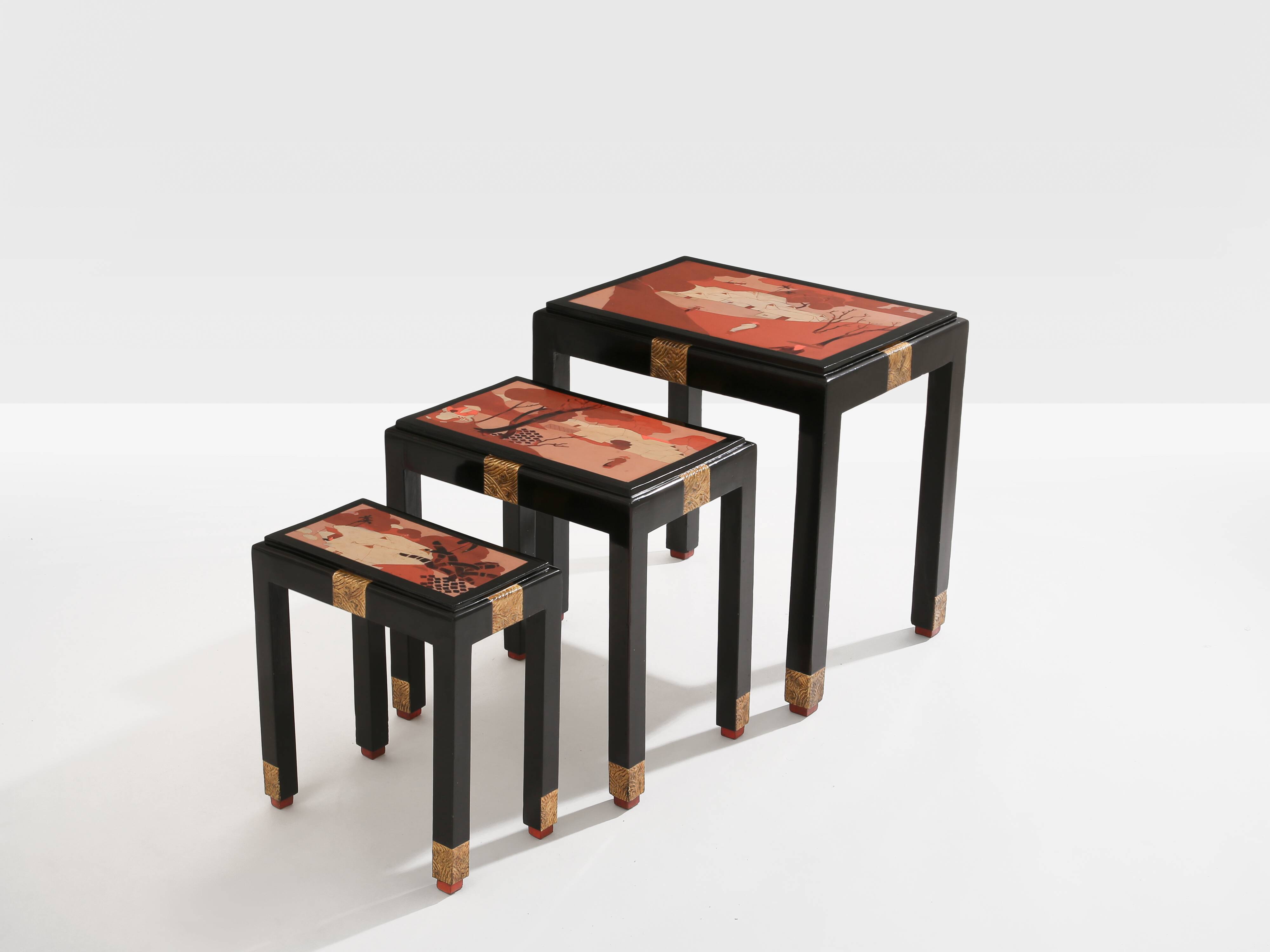 Set of three nesting tables with Asian decor, blackened wood, circa 1920.