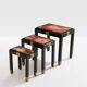 Set of three nesting tables with Asian decor, blackened wood, circa 1920.