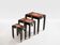 Set of three nesting tables with Asian decor, blackened wood, circa 1920.