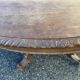 Oval hunting table in solid wood with dragon decoration.