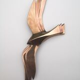 Birds stylized in brass