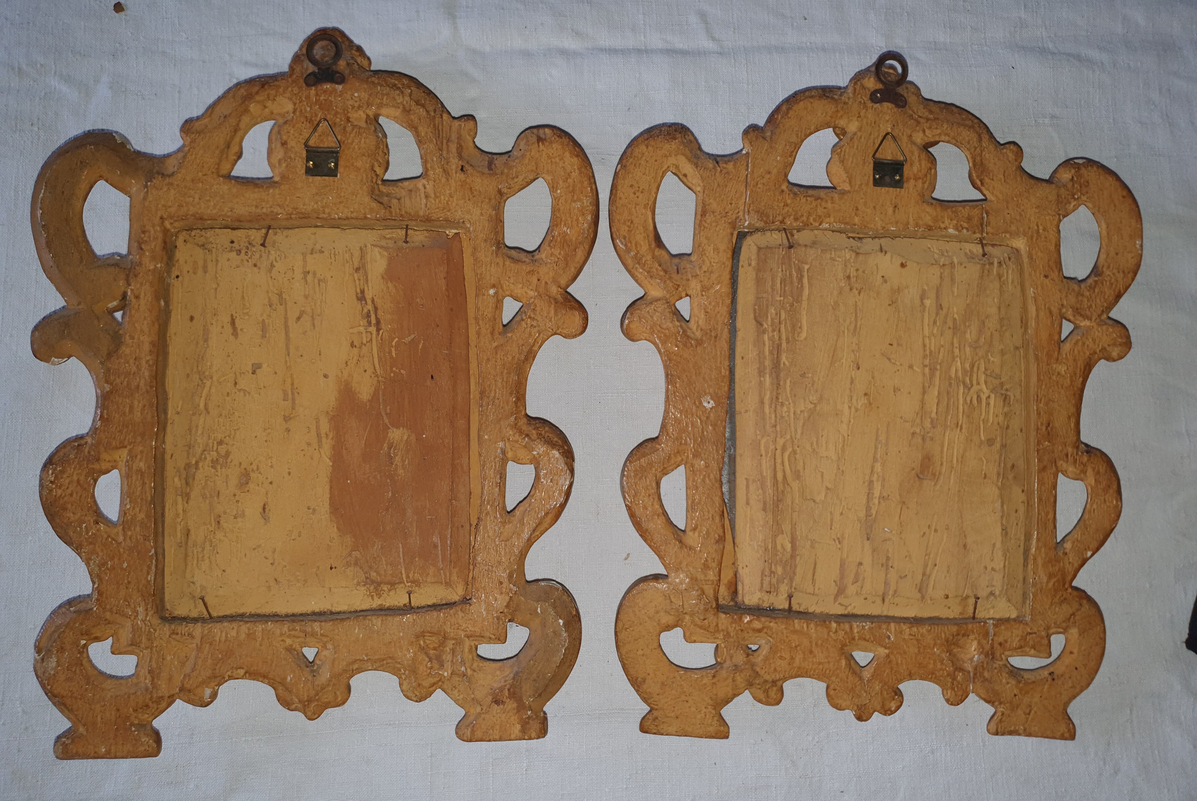 Pair of gilded wooden mirrors with cherub decoration 27x35cm