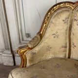 A Louis XV style child's bergère chair in carved and gilded wood, circa 1880