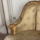 A Louis XV style child's bergère chair in carved and gilded wood, circa 1880