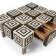 An Art Deco Op Art coffee table made of beech wood with drawers.