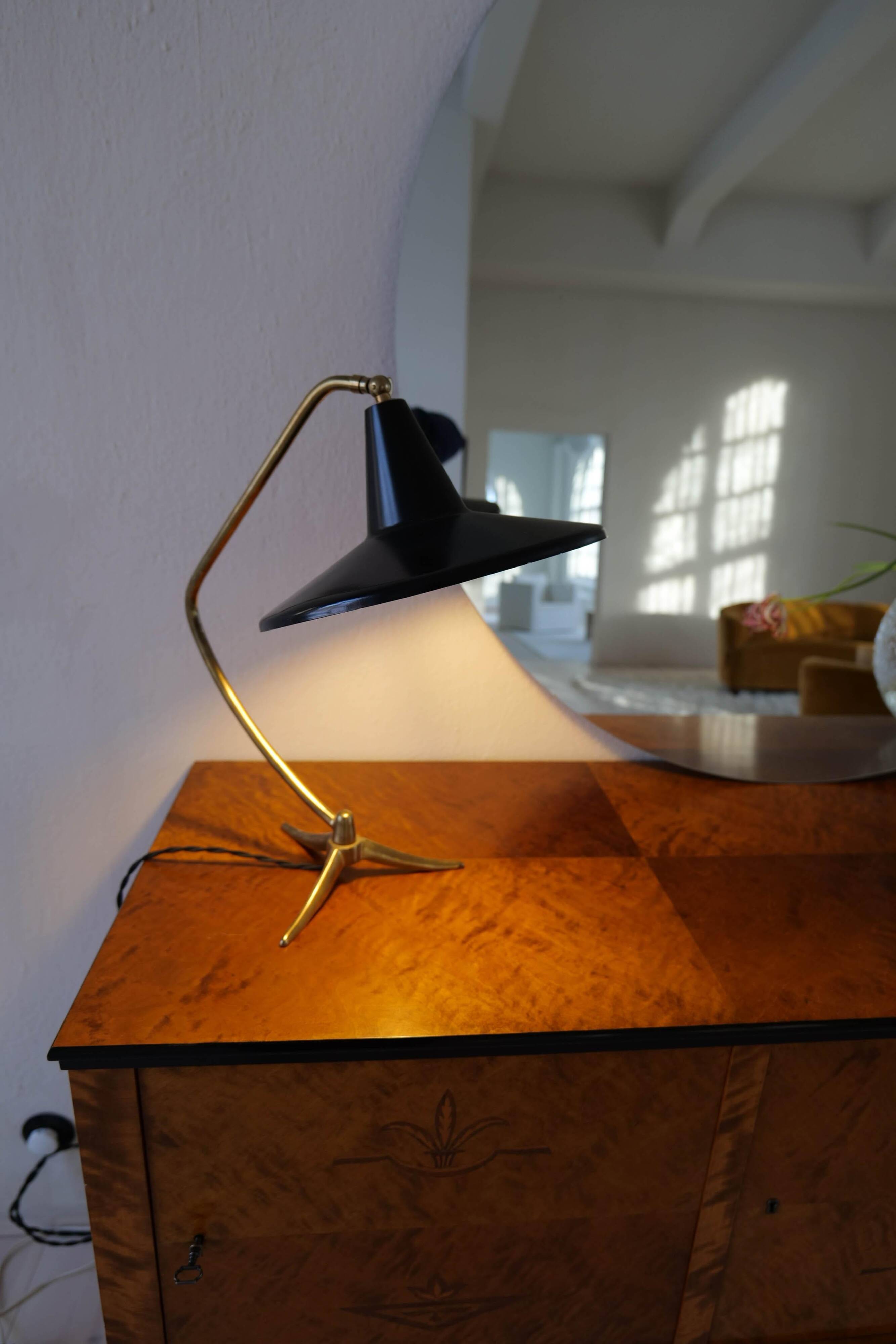 Brass table lamp on a tripod in modern Swedish style, Sweden, 1950.