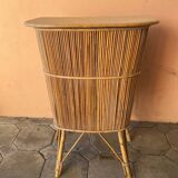 Vintage rattan bar from the 60s with rounded shapes and a shelf for glasses