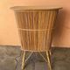 Vintage rattan bar from the 60s with rounded shapes and a shelf for glasses