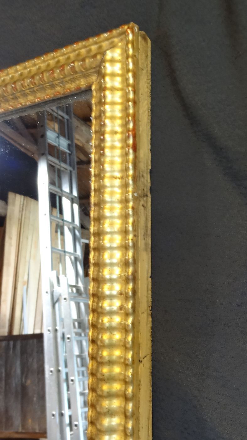 Gilded stucco mirror with gold leaf, H 152 cm