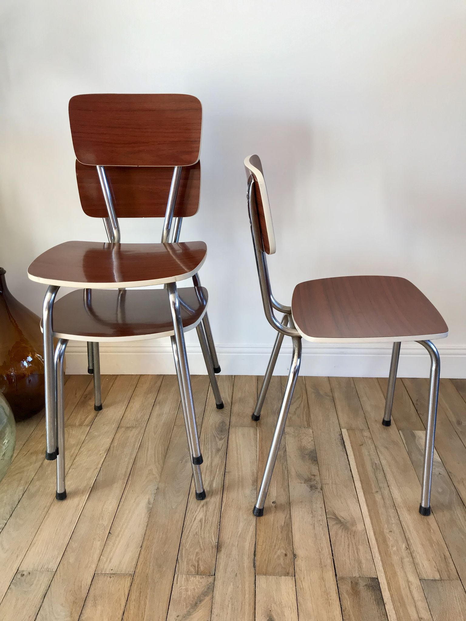 Trio of chairs in light brown formica and cream contour 70s