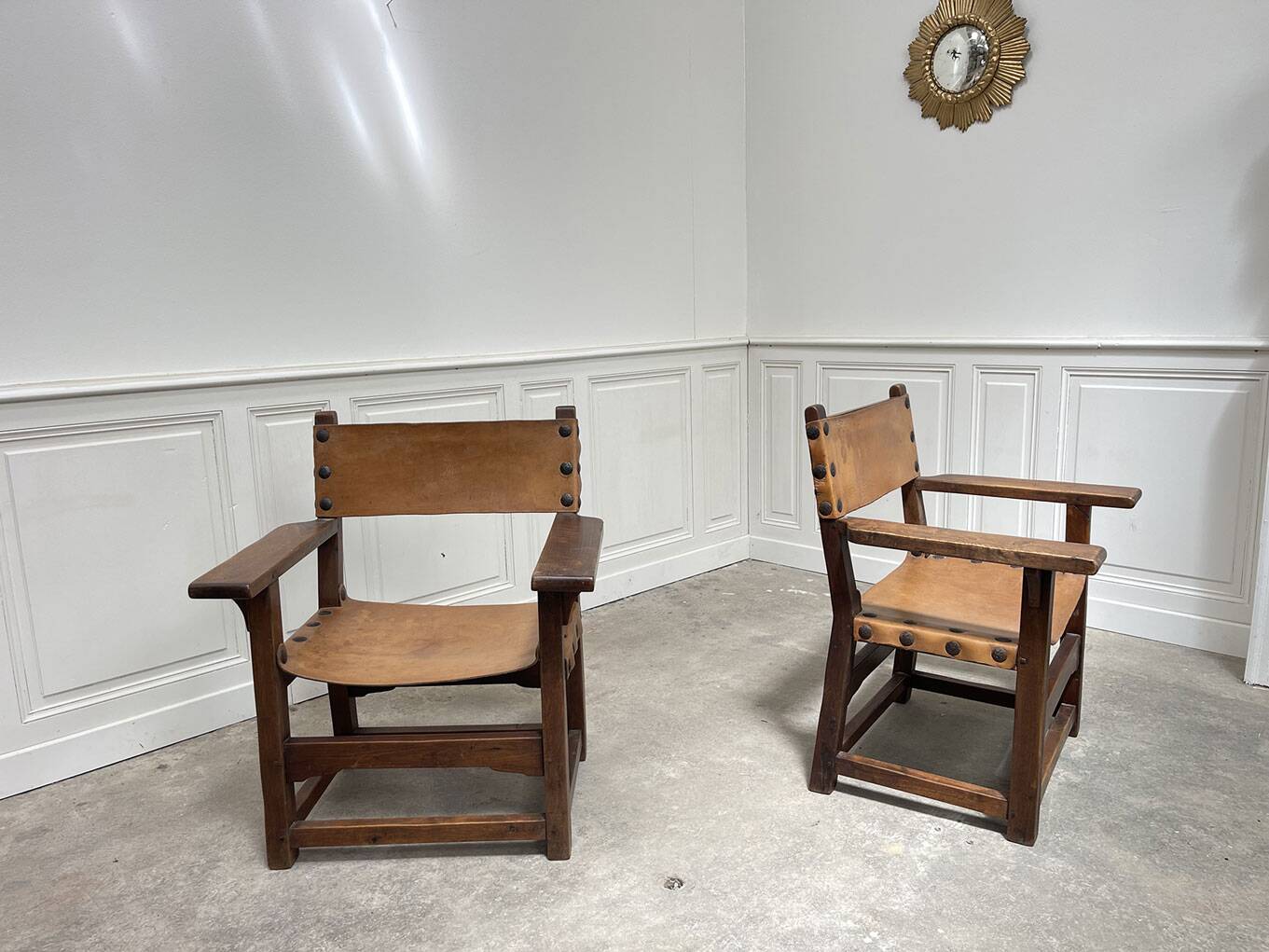 Pair of leather and walnut armchairs from the 1950s