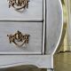 Curved patinated chest of drawers