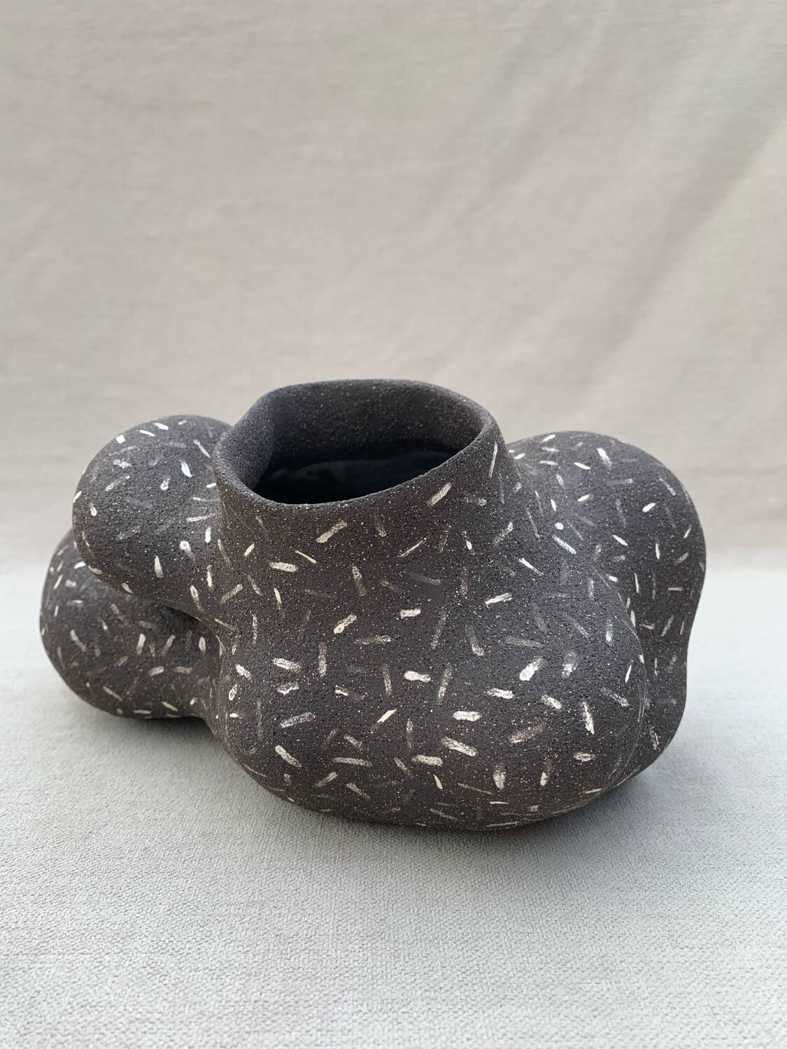 Raw black stoneware vase