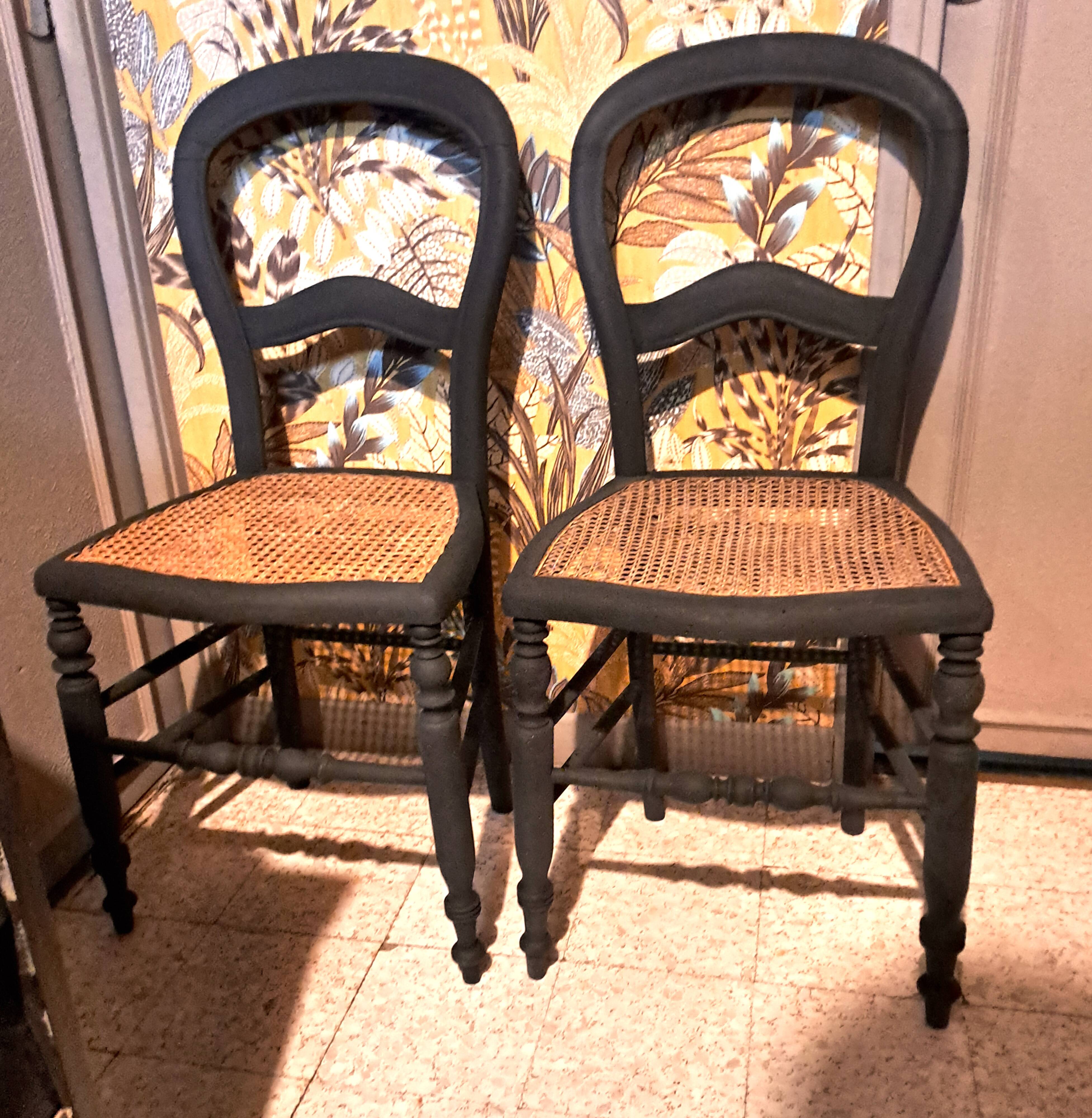 Pair of 2 chairs with cane seats in black wood, circa 1940