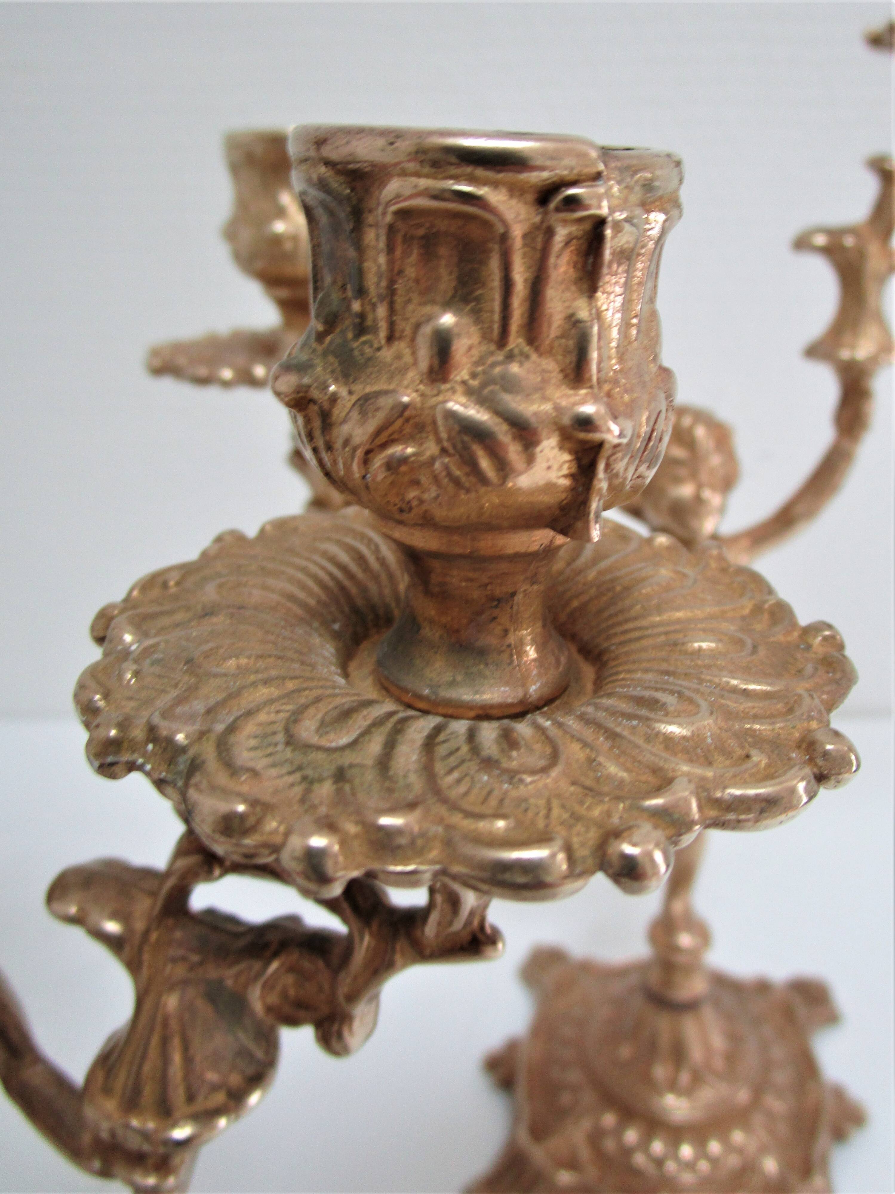 Pair of vintage golden brass cherub candlesticks