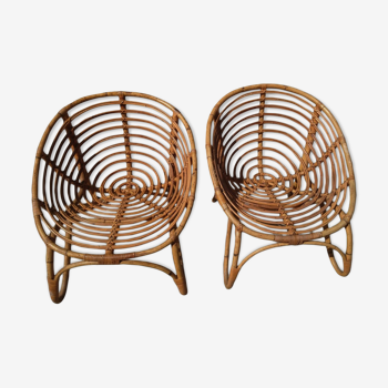 A pair of vintage rattan armchair